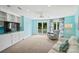 Bright bonus room with built-in cabinets, a ceiling fan, and a private balcony with a view at 469 Valley Run Dr, Waxhaw, NC 28173