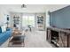 Relaxing bonus room features a TV, blue couch and sports decor perfect for entertainment or leisure at 5107 Raging Creek Dr, Indian Trail, NC 28079