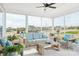 Relaxing screened porch with comfortable seating, offering a tranquil outdoor living space at 5107 Raging Creek Dr, Indian Trail, NC 28079