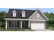 Charming single-Gathering home with stone accents, gray siding and a welcoming front porch at 5107 Raging Creek Dr, Indian Trail, NC 28079