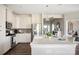 Bright kitchen featuring stainless steel appliances and a breakfast bar area at 5107 Raging Creek Dr, Indian Trail, NC 28079