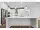 Bright kitchen featuring stainless steel appliances, a large island, and modern pendant lighting at 5107 Raging Creek Dr, Indian Trail, NC 28079
