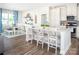 Well-lit kitchen with a large island, stainless steel appliances, and eat-in breakfast area at 5107 Raging Creek Dr, Indian Trail, NC 28079
