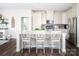 Kitchen featuring a large center island with seating and stainless steel appliances at 5107 Raging Creek Dr, Indian Trail, NC 28079