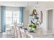 Kitchen with a white island, breakfast bar, and view into the dining room at 5107 Raging Creek Dr, Indian Trail, NC 28079
