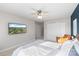 Bright bedroom featuring wall mounted TV, a large closet, and neutral colored walls at 511 Donatello Ave, Charlotte, NC 28205