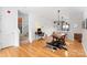 Bright open-concept dining area with hardwood floors, stylish lighting, and desk at 511 Donatello Ave, Charlotte, NC 28205