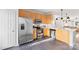Kitchen featuring stainless steel appliances, white backsplash, and light wood cabinetry at 511 Donatello Ave, Charlotte, NC 28205