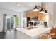 Modern kitchen with stainless steel appliances, quartz countertops, and balcony access at 511 Donatello Ave, Charlotte, NC 28205