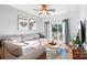 Bright living room featuring a large sectional couch and balcony access at 511 Donatello Ave, Charlotte, NC 28205