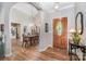Welcoming foyer with wood floors, chandelier, and views of the dining room and kitchen at 5208 Black Oak Ln, Waxhaw, NC 28173
