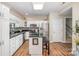 Well-lit kitchen with stainless steel appliances, granite counters, and an island with seating at 5208 Black Oak Ln, Waxhaw, NC 28173
