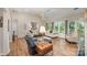 Spacious living room featuring hardwood floors, comfortable seating, and natural light at 5208 Black Oak Ln, Waxhaw, NC 28173