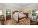 Comfortable main bedroom with natural light, a ceiling fan, and ample closet space at 5208 Black Oak Ln, Waxhaw, NC 28173