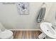 Elegant powder room features a pedestal sink, modern fixtures and clean aesthetic at 5391 Orchid Bloom Dr, Fort Mill, SC 29707