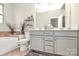 Bright bathroom featuring a dual vanity, soaking tub, and toilet at 5391 Orchid Bloom Dr, Fort Mill, SC 29707