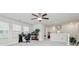 Bright bonus room with a ceiling fan, a desk, and lots of natural light at 5391 Orchid Bloom Dr, Fort Mill, SC 29707
