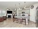 Modern eat-in kitchen with stainless steel appliances, a granite island, and open sightlines to living room at 5391 Orchid Bloom Dr, Fort Mill, SC 29707