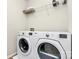 Laundry room featuring modern appliances and ample shelf space at 5391 Orchid Bloom Dr, Fort Mill, SC 29707