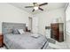 Bedroom with neutral colors, carpeted floor, a ceiling fan, and natural light at 5391 Orchid Bloom Dr, Fort Mill, SC 29707