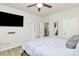 Comfortable bedroom with a ceiling fan, natural light and a mounted television at 5391 Orchid Bloom Dr, Fort Mill, SC 29707