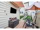 Enjoy outdoor entertainment in this patio area with chairs, an umbrella, and a wall-mounted TV at 5391 Orchid Bloom Dr, Fort Mill, SC 29707