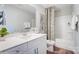 Elegant bathroom featuring a modern vanity, a toilet, and a shower with a curtain at 5666 Stafford Rd # 9, Charlotte, NC 28054