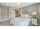 Inviting bedroom featuring plush carpet, natural light, and ample storage at 5666 Stafford Rd # 9, Charlotte, NC 28054