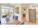 Bright dining area with gray cushioned chairs and a view to the office at 5666 Stafford Rd # 9, Charlotte, NC 28054