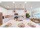 Stylish kitchen showcasing a large center island, stainless steel appliances, and modern white cabinetry at 5666 Stafford Rd # 9, Charlotte, NC 28054