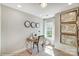 This office has a bright window and is decorated with clocks and maps at 5666 Stafford Rd # 9, Charlotte, NC 28054