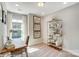 Bright office space with a wooden desk, chair, and ample storage for organization at 5666 Stafford Rd # 9, Charlotte, NC 28054
