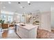 Bright open-concept living area featuring a kitchen with a large island and a cozy living room at 5666 Stafford Rd # 9, Charlotte, NC 28054
