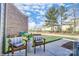 Charming backyard patio seating provides a cozy outdoor space to relax and enjoy the manicured backyard at 5666 Stafford Rd # 9, Charlotte, NC 28054