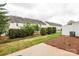 Well-maintained backyard with privacy hedges and a small grassy area at 5951 Carrollton Ln, Charlotte, NC 28210