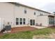 Spacious backyard with a small patio and well-kept lawn at 5951 Carrollton Ln, Charlotte, NC 28210