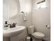 Powder room with pedestal sink and fixtures, plus a window for natural light at 5951 Carrollton Ln, Charlotte, NC 28210