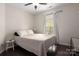 Cozy bedroom with hardwood floors and a window for natural light at 5951 Carrollton Ln, Charlotte, NC 28210