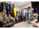 Walk-in closet featuring a built-in storage system for clothing and shoes at 5951 Carrollton Ln, Charlotte, NC 28210