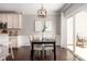 Charming dining area with a modern chandelier and sliding glass doors to the patio at 5951 Carrollton Ln, Charlotte, NC 28210