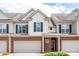 Attractive townhome featuring a brick facade and covered entryway at 5951 Carrollton Ln, Charlotte, NC 28210