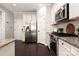 Well-equipped kitchen featuring stainless steel appliances, granite counters, and ample cabinetry at 5951 Carrollton Ln, Charlotte, NC 28210