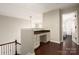 Open loft area with a built-in desk and hardwood flooring at 5951 Carrollton Ln, Charlotte, NC 28210
