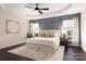 Main bedroom featuring tray ceiling, wainscoting, and ample natural light at 5951 Carrollton Ln, Charlotte, NC 28210