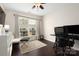 Home office with large windows for natural light and a neutral color palette at 5951 Carrollton Ln, Charlotte, NC 28210