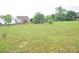 Expansive backyard featuring a lush green lawn, offering ample space for outdoor activities at 6105 Follow The Trl, Indian Trail, NC 28079