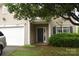 Inviting front entrance with a covered porch, complemented by manicured shrubs at 6105 Follow The Trl, Indian Trail, NC 28079