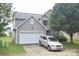 Charming two-story home with a two-car garage and well-maintained lawn and landscaping at 6105 Follow The Trl, Indian Trail, NC 28079