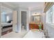 Bathroom featuring a standalone tub, vanity with granite counters, and tiled floors at 6132 Sharon Rd, Charlotte, NC 28210