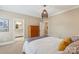 Bedroom with ensuite bathroom featuring a wooden dresser and a neutral color palette at 6132 Sharon Rd, Charlotte, NC 28210
